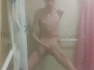 Skinny boy strokes his big wet cock after shower