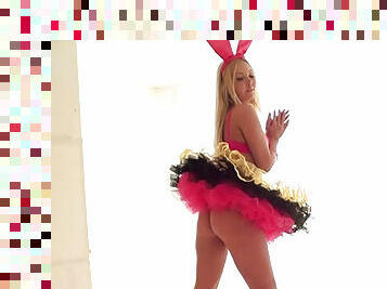 Cute young blonde poses in costumes