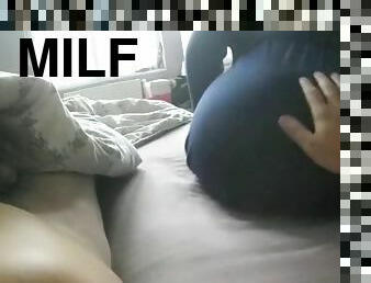 A milf wakes up her husband and then rides his cock