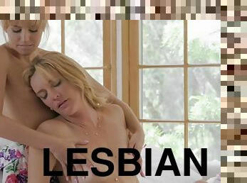 Beautiful blonde lesbians licking each other in bed