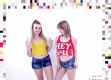 Cute Lesbian Teenies hump with strap on in studio