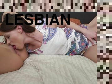 Beautiful old and young lesbian couple at bed