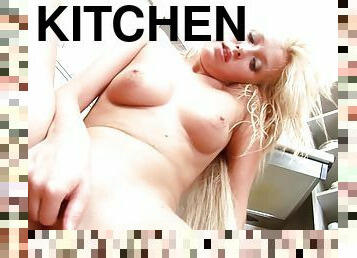 Sweet blonde fingering in the kitchen