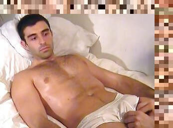 Handsome newbie in porn gets wanked his huge cock by us: Esteban