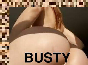 Busty brunette masturbates solo