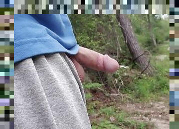 taking a piss deep in the woods with flexing at the end