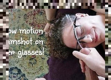 Slow motion cumshot on her glasses!