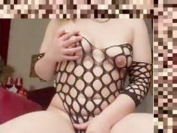 naughty girl fingers her pussy in fishnet