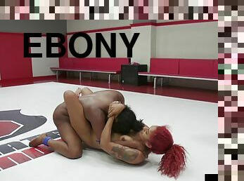 Defeated lez Ebony wrestler sucks strapon after losing match