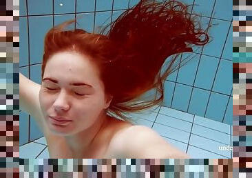 Lola, a young girl with a juicy body, swims naked