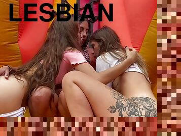 Horny lesbians fuck in a bouncy castle