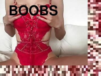 Sexy red lingerie body girl squeezing her boobs