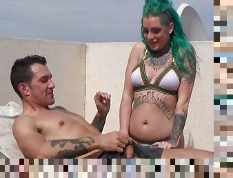 Green haired tattooed slut rides a cock on the rooftop