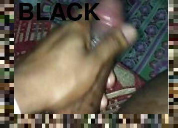 Boyfriend stroking his black cock.