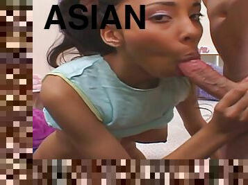 Stunning Asian teen is sucking a hard pole