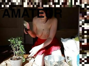 Sexy girl plants her plants in just an apron and let you watch, naked sensual tease