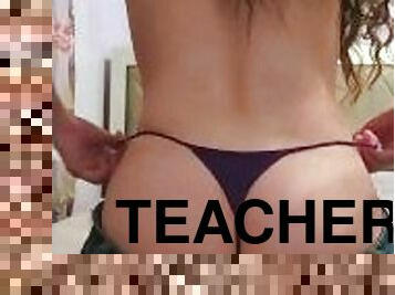 Brunette Teacher pulls her jeans down and shows off her G-String
