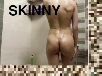 Skinny girl takes a shower