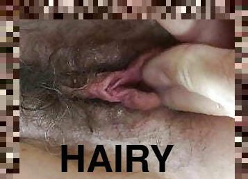Fingering her hairy pussy...