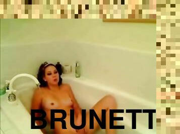 Cute Brunette With Headband in Bathtub