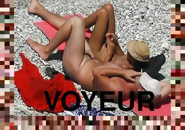 Voyeur. Girl Jerks Off dick her boyfriend at a public beach