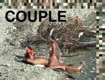 Couple fucking on a public beach, while walking past people