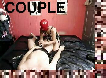 Couple in kinky latex fucking