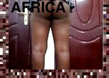 African wife with a sexy mini skirt posing for husband