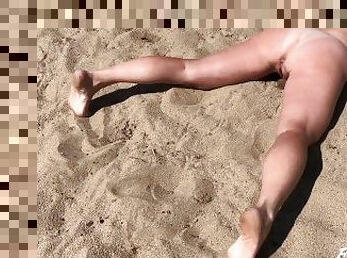 Peeing while lying on the beach