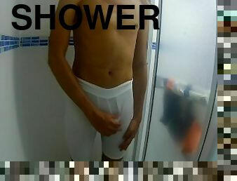 Young man masturbates three times in underwear under the shower