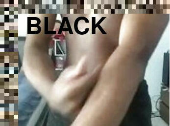 Sexy Black man rubbing lotion on body