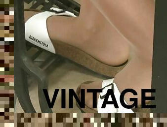 Lovely Petra in nude-colored tights working on a vintage pedal sewing machine