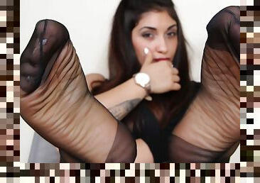 Sexy Sharon takes off her black leather thigh-high boots and flaunts her nyloned feet
