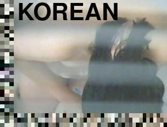 Korean girl shaves her pussy in shower