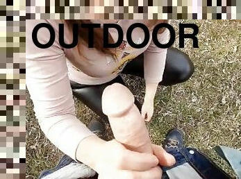 She jerks off my cock in outdoor