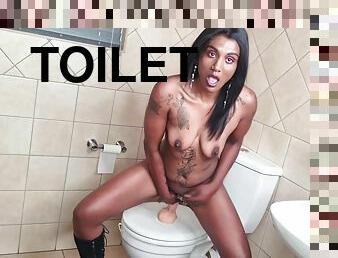 My Dark Desi Slut Self Riding A Dildo Stuck To The Toilet Seat Lid While Wearing Black Heeled Boots