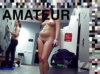 Naked brunette in the locker room after a workout.