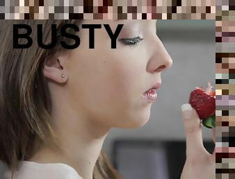 Busty Buffy caresses herself with a strawberry