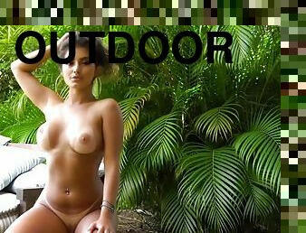 Erotic model with perky tits and sexy tan lines outdoors