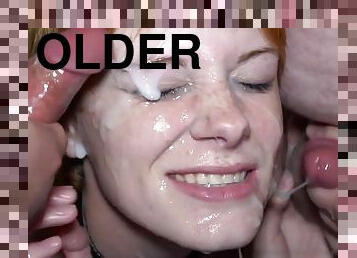 Cute young redhead gets facial bukkake cumshot from older dudes in threesome