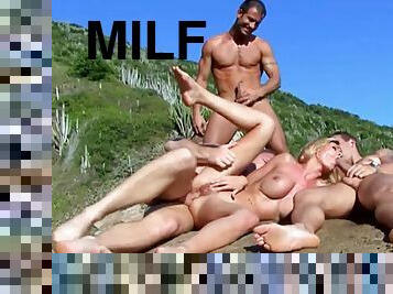 Blonde MILF in an outdoor gangbang scene