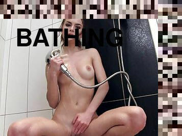 Hot teen starts touching herself in the shower