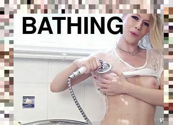 Blonde slut enjoys bath time in sheer stockings and panties