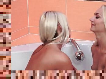 Blonde girls in bathtub get wet and fool around