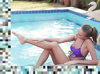 Stunning teen babe masturbates sensually by the pool