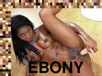 Jasmine ebony chick plays with a dildo