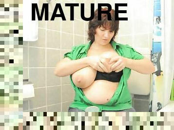 Mature amateur l milks her big tits in the mirror