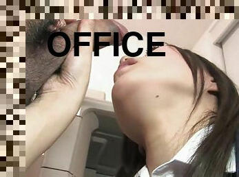 Office bitch is on her knees sucking two hard cocks