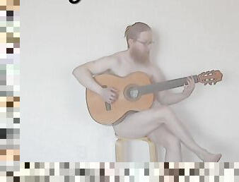 DJ Phuzzy plays guitar naked