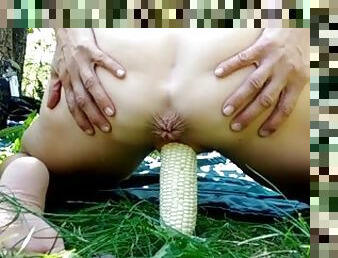 Amazing insertion! Hot MILF Josie fucks a huge ear of corn outdoors while spreading her ass.